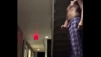 African man Busting nut outside his house