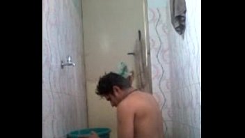 Naked Indian man having bath