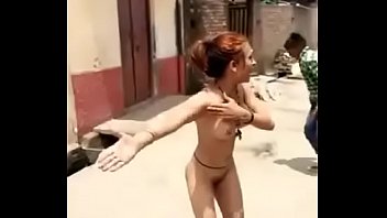 Girl fun in streets with naked body .