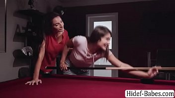 Stepdaughter is playing billiards in their house and suddenly,her stepmom arrives and she then teaches her stepdaughter how to play billiard well.After that,they get tired and start kissing each other.Next is they lick their wet pussies on the table.