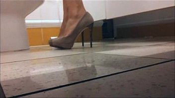 Milf with high heels in the WC